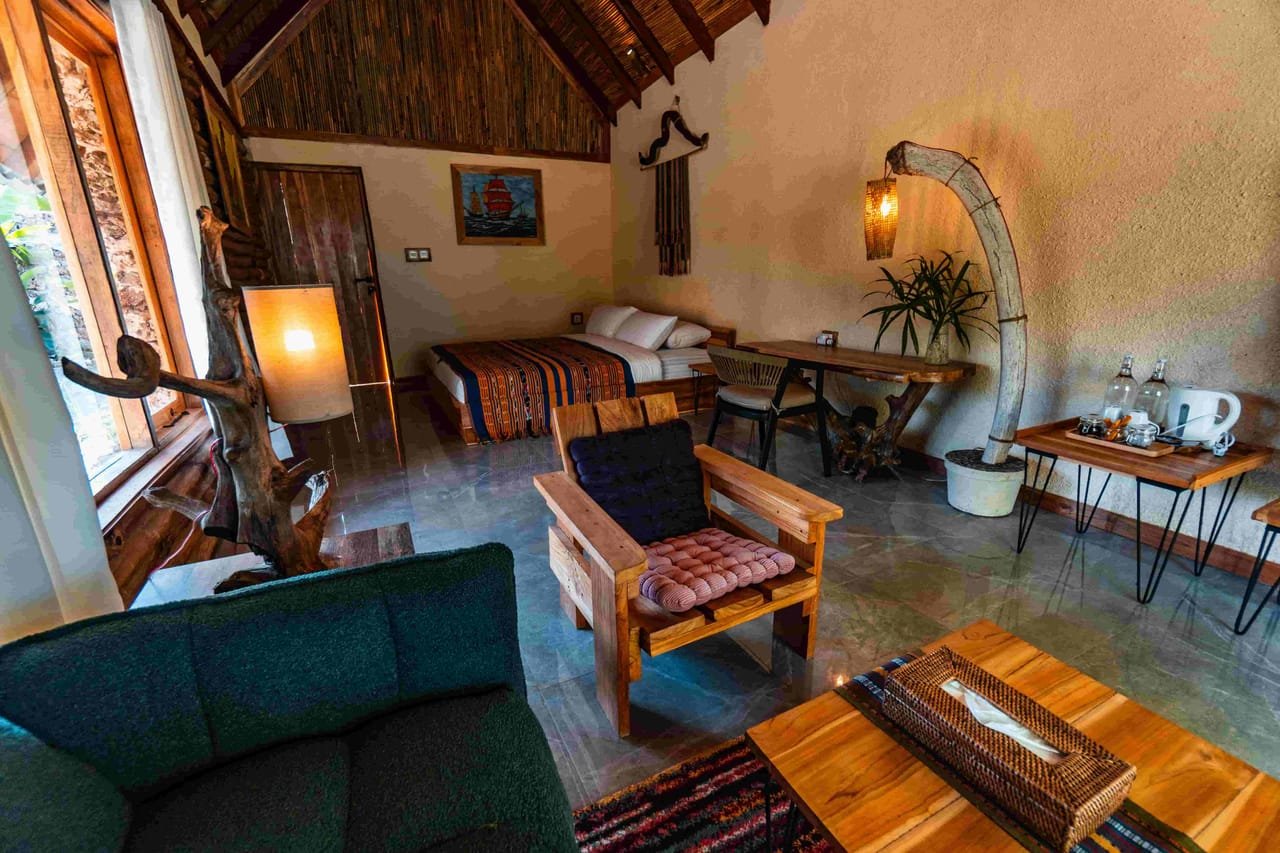 Garden View villa interior with king-size bed and louvered windows