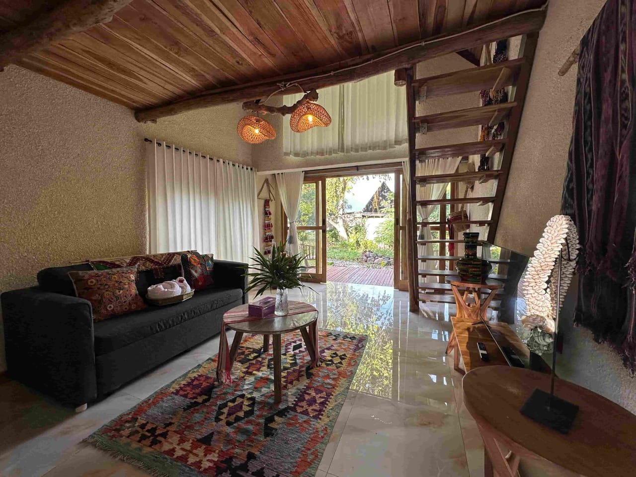 Loft Suite living area opening onto the tropical garden